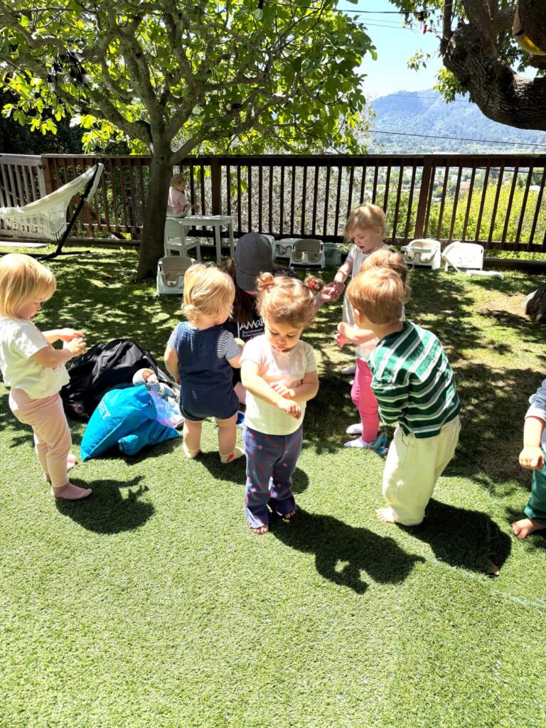 Toddlers playing outdoors at Discovery Time Daycare Greenbrae CA